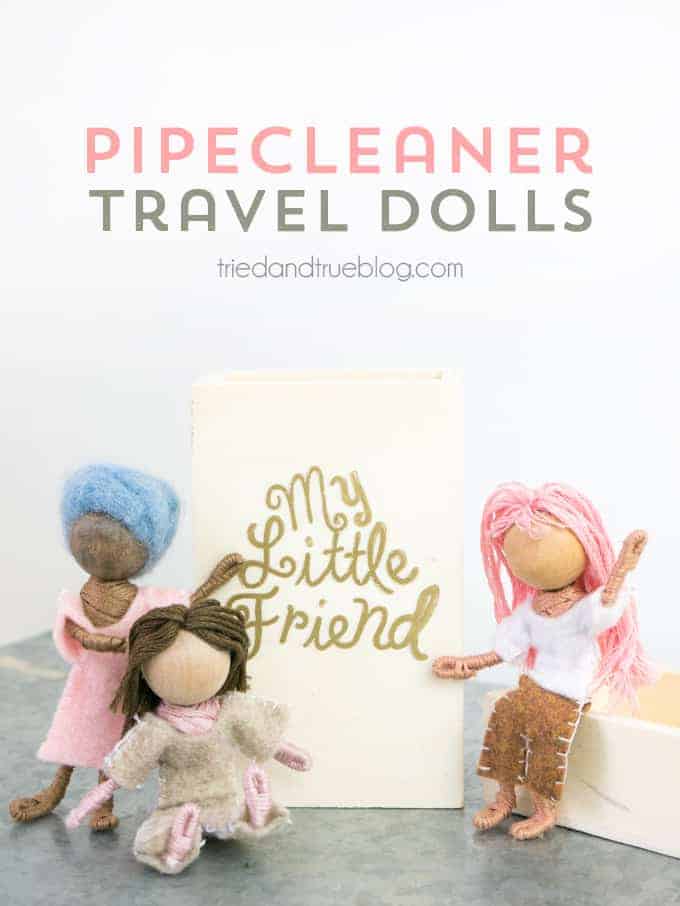 Three little pipecleaner dolls sitting around a small wood box with the words