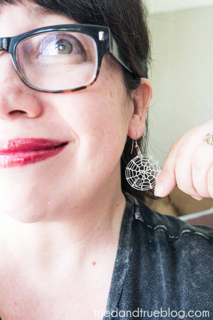 Woman wearing Halloween Spider Web Earrings