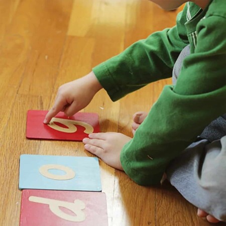 Child using Montessori Sandpaper Letters