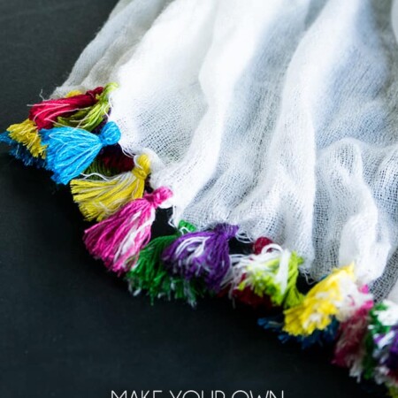Make Your Own Tassel Scarf - Add a pop of color to a plain scarf with this tassel tutorial! #scarf #diyfashion