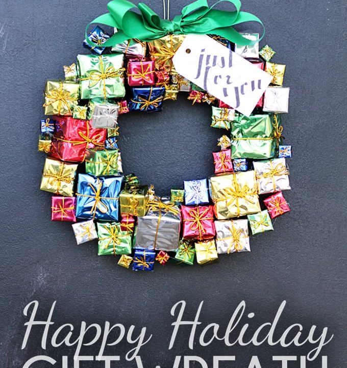 Use those inexpensive miniature gift decorations to create this Happy Holiday Gift Wreath!
