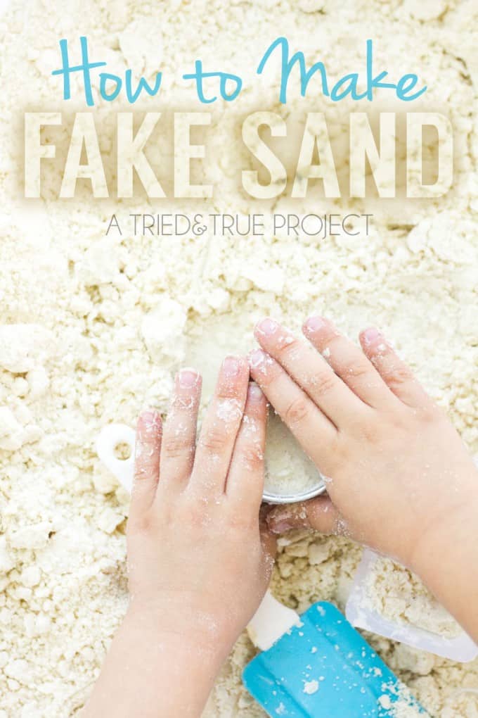 Child's hand playing in Easy Fake Sand with blue spatula.