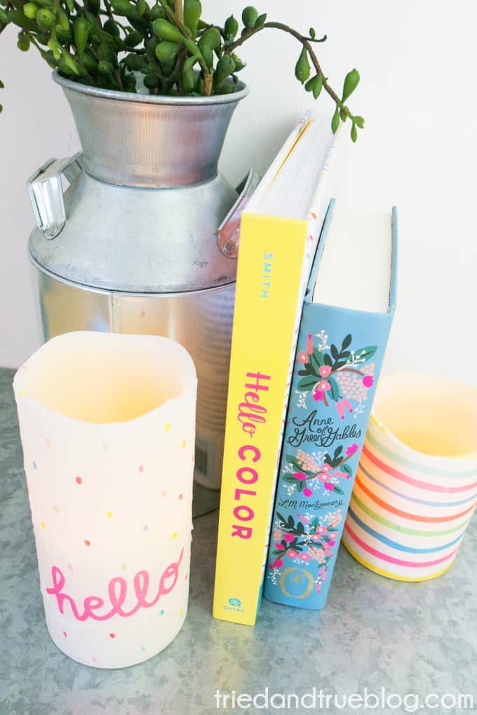 Set up of Decoupage Custom Candles with books and plants