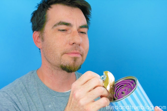 Man opening his Father's Day Gift Can