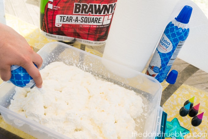 Adding the whipped cream to a large bucket