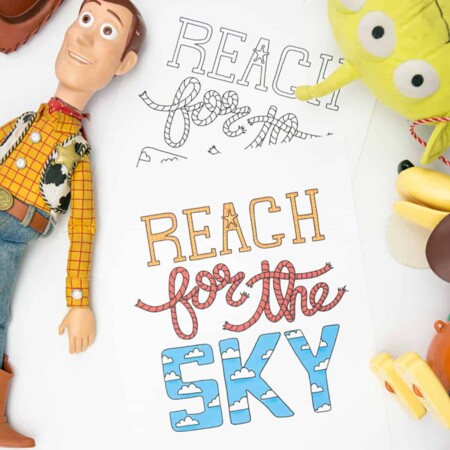 Hand holding the Toy Story Reach for the Sky printable and coloring page
