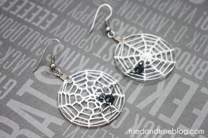 Hoop earrings with crochet spider webs and rhinestone spiders.