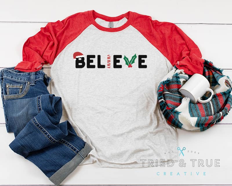 Red raglan t-shirt with the "Believe" free svg file in center.