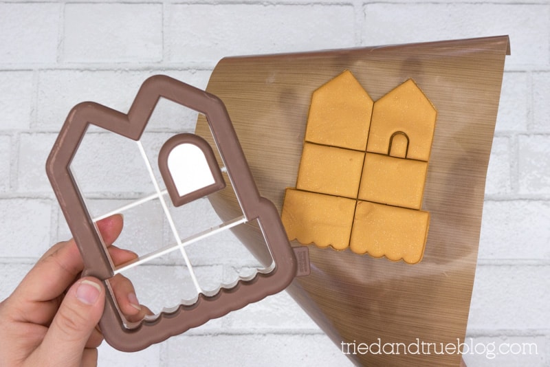 Use gingerbread house cookie cutter to cut clay.