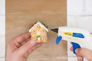 More white hot glue being dripped off roof.