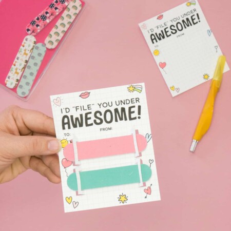Hand holding Nail File Punny Valentine Gift with words "I'd file you under Awesome!"
