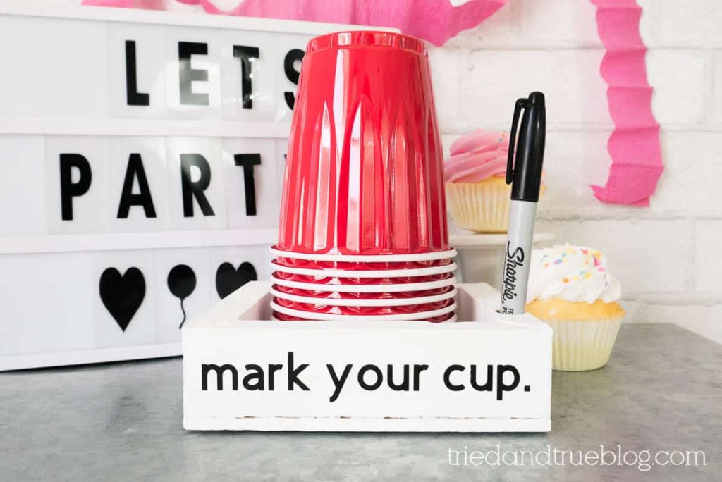 Party cup holder with the words "Mark your cup."
