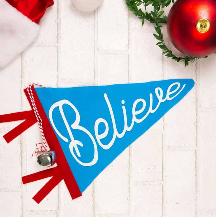 Blue Felt Christmas Pennant Flag with word "Believe" on a white background.