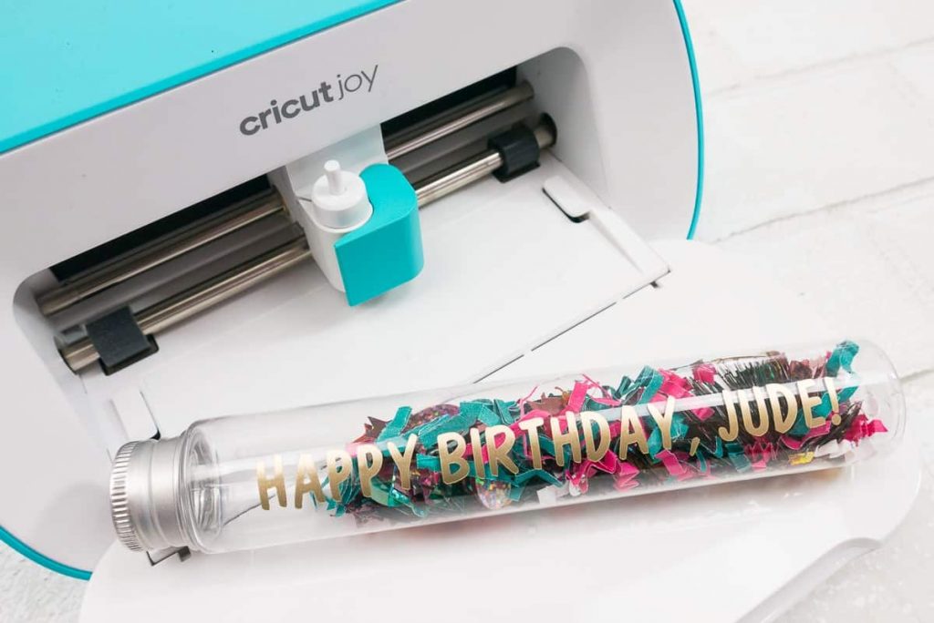 Birthday test tube with confetti and the words "Happy Birthday, Jude!" on a Cricut Joy.