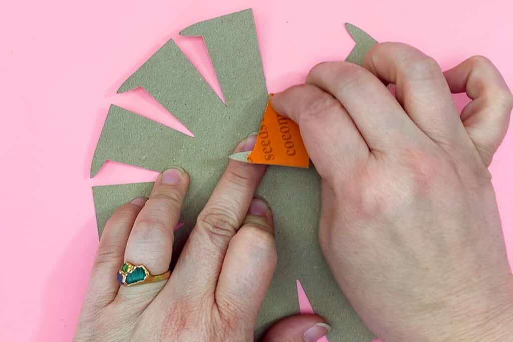 Hands folding back cardboard extension