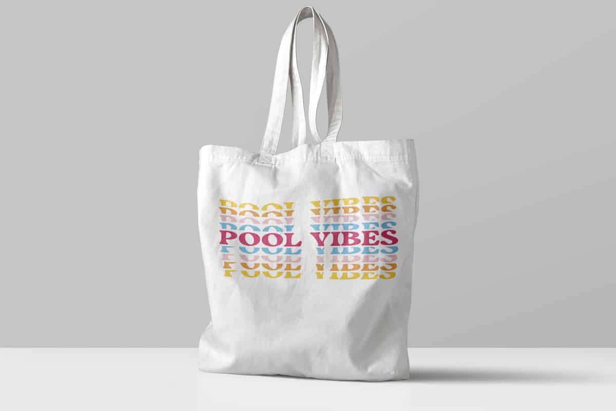 White bag on gray background with the word Pool Vibes