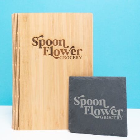 Coaster and bamboo journal with words "Spoon Flower Grocery"