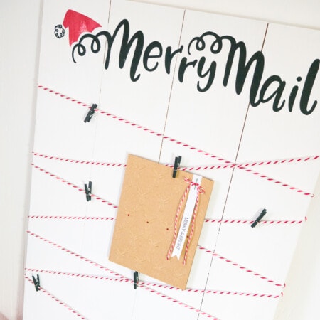 A wooden board with a merry mail sign on it.