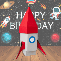 A paper rocket with happy birthday written on it, featuring a free SVG file.